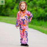 Girl wearing AnnLoren 2-Pc tie dye ruffle hoodie and track pants in pink, orange, and purple outdoors