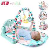 Baby playing on a colorful Baby Fitness Stand with music, play gym arch, and hanging toys for tummy time and sensory development