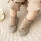 Cute cartoon baby socks shoes with slip-on design and soft cotton fabric for infants and toddlers.