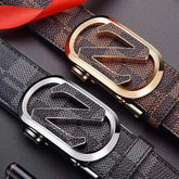 Two premium leather men belts with stylish patterned design and distinctive metal buckles, one with a gold-tone buckle and the other with a silver-tone buckle.