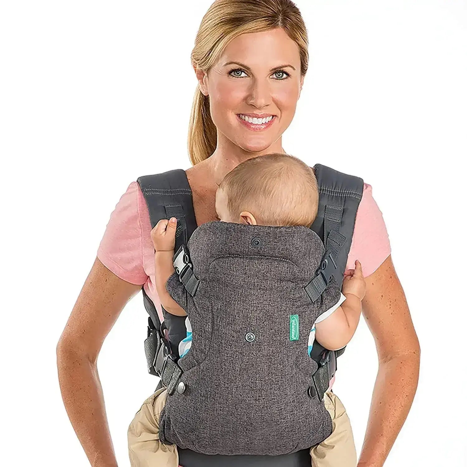 Woman wearing baby in All Seasons Newborn Front Facing Wrap Carrier in gray with secure straps and breathable fabric