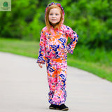 Girl wearing AnnLoren 2-Pc tie dye ruffle hoodie and track pants in pink, orange, and purple outdoors