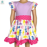Adorable girls Easter bunny dress with pink and purple ruffles, polka dot trim, and colorful bunny print