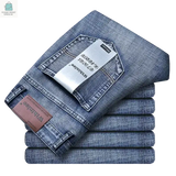 Men's casual straight stretch jeans in fashionable blue black folded with Withinlee brand label visible